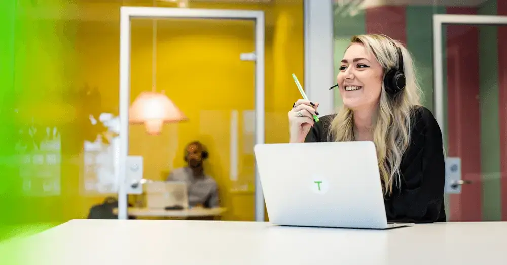 Women with headset in an office environment.